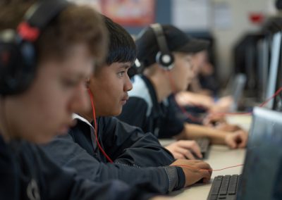 Students in the computer room looking at their monitors