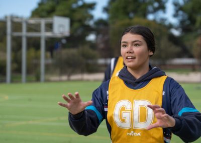 Female student playing netball